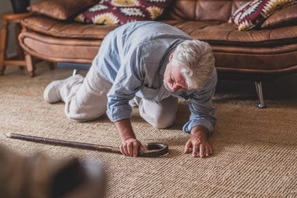 man falling with cane