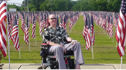 Man in wheelchair at Memorial Day Flag Field 