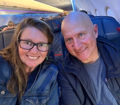 Heather and Geoff Krill sitting in a commercial airplane