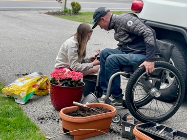 Geoff and daughter planting