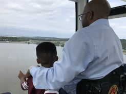 Sherman and his son looking out at a body of water