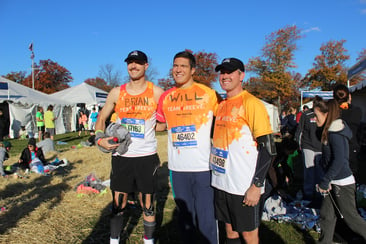 Will and other members of Team Reeve wearing orange Team Reeve shirts before the marathon