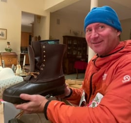 Geoff holding a boot