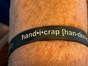 arm with a handi crap bracelet