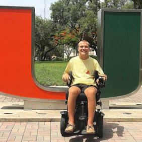 Ian in front of University of Miami sign