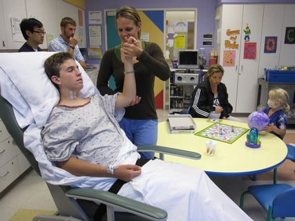 Zack undergoing physical therapy in the hospital