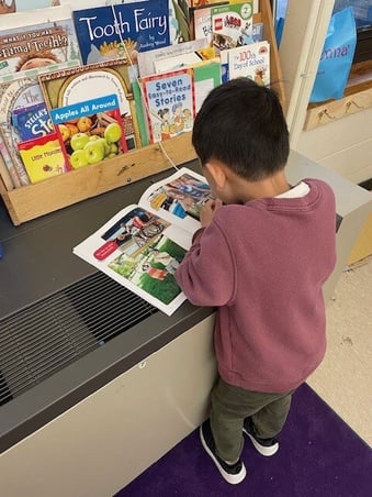 Child reading SCI Children's Book