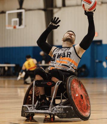 Man in wheelchair playing basketball