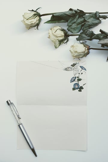 letter and pen with roses