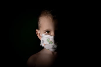 child with covid mask