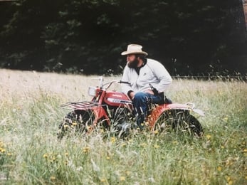 Tim Gilmer in the field on a tractor 