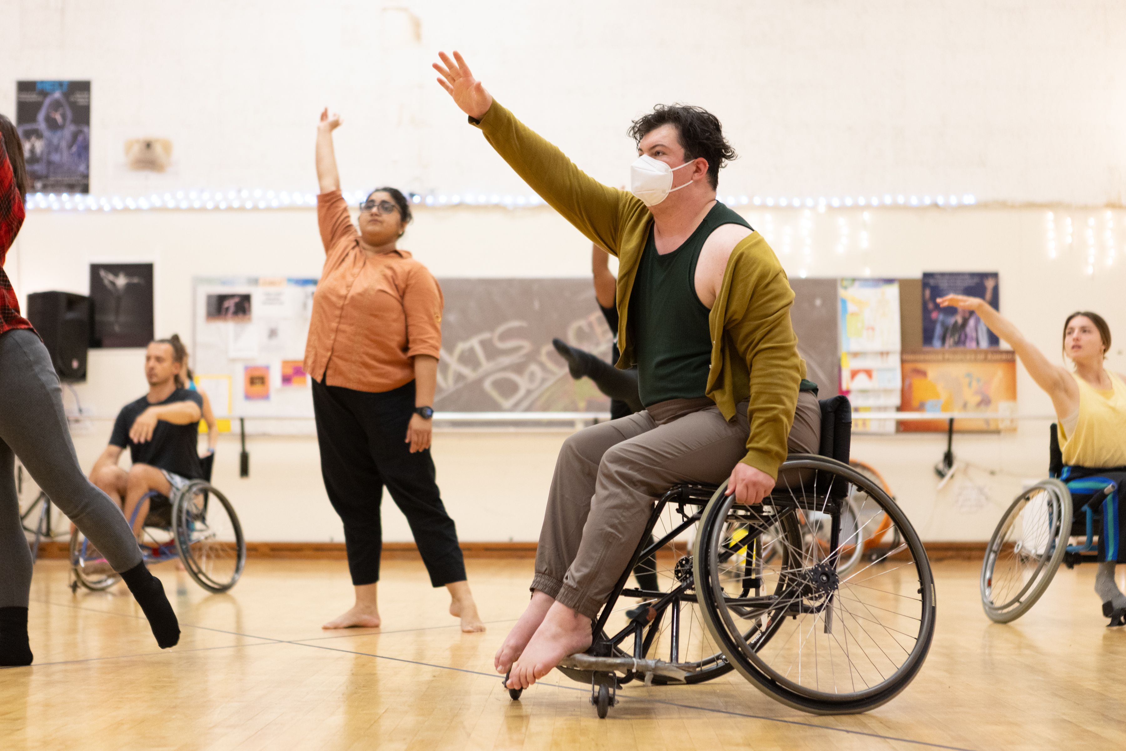 person in wheelchair dancing