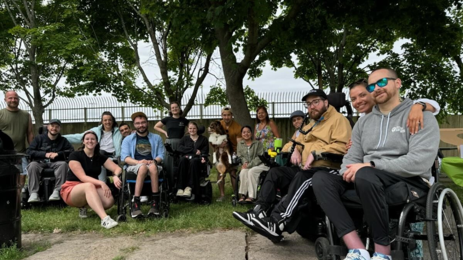 SCIboston group together in wheelchairs