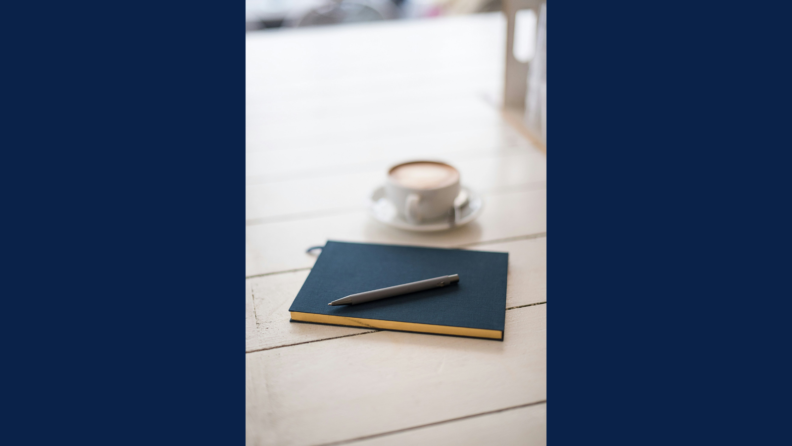 journal and cup of coffee