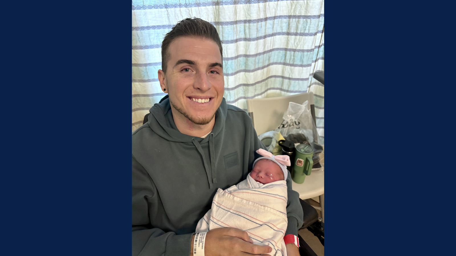 Zack Collie with newborn