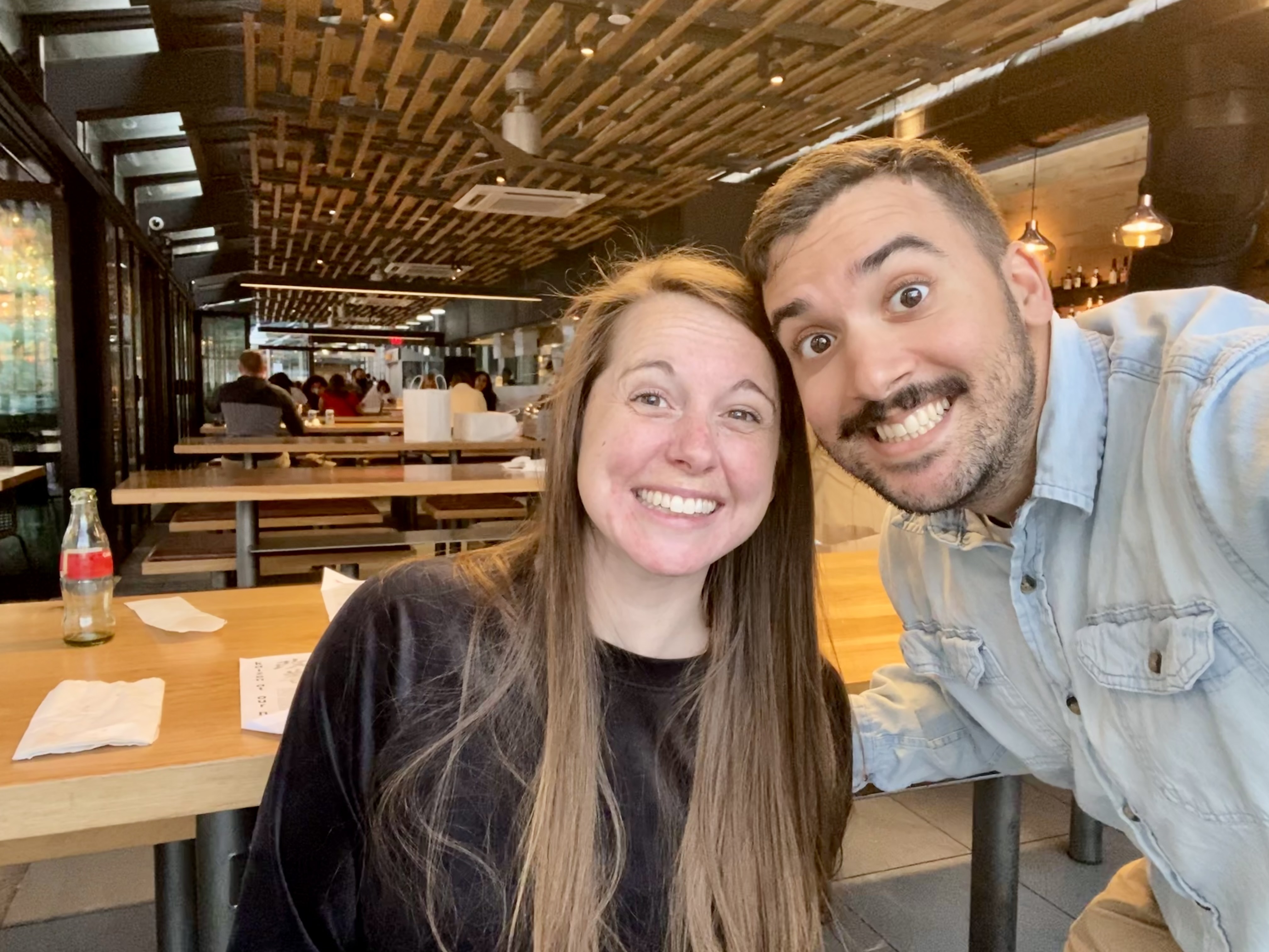 Kristin and her husband with big smiles