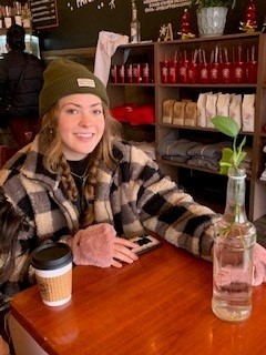 Zack's sister at a coffee shop