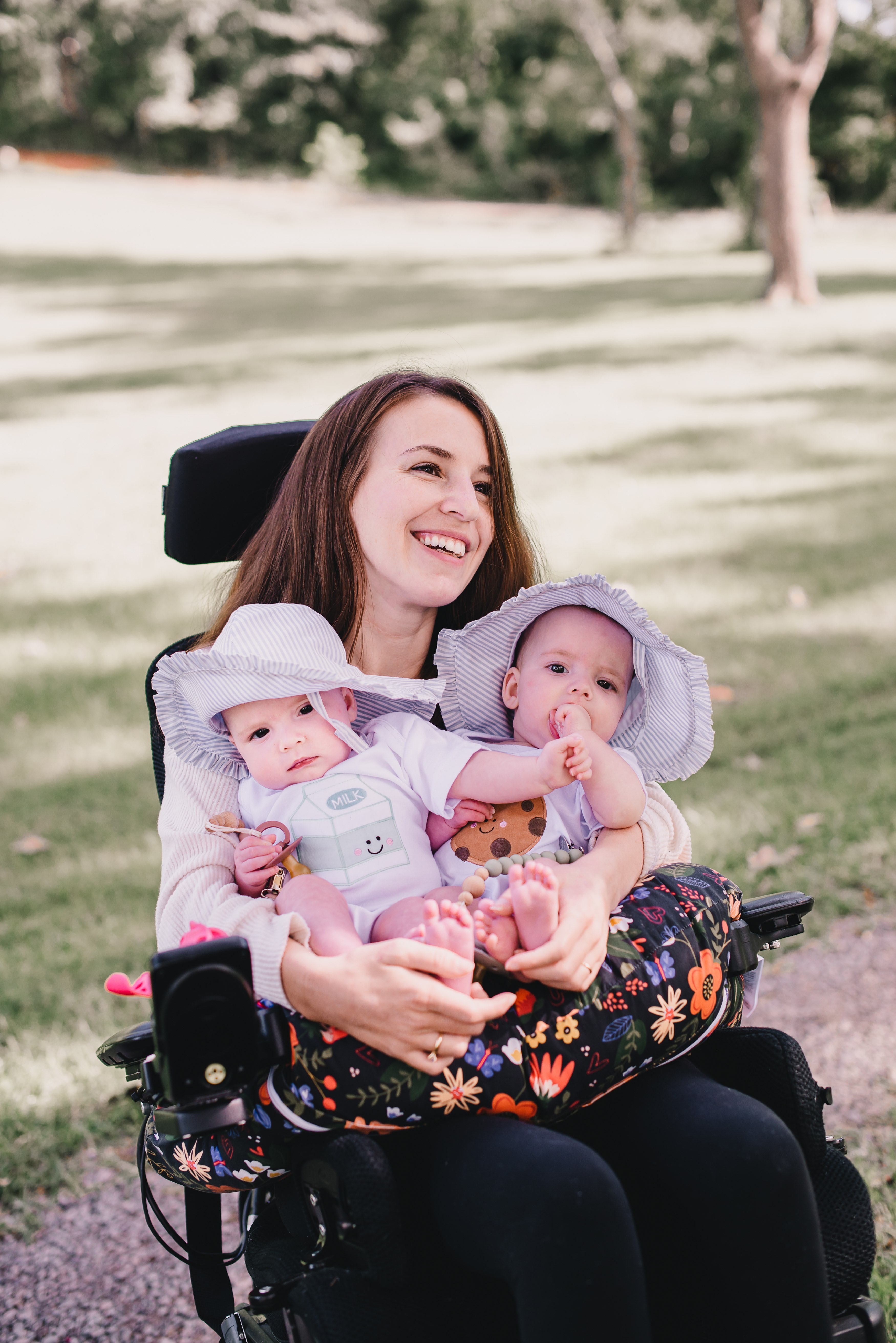 Dani holding her twin daughters