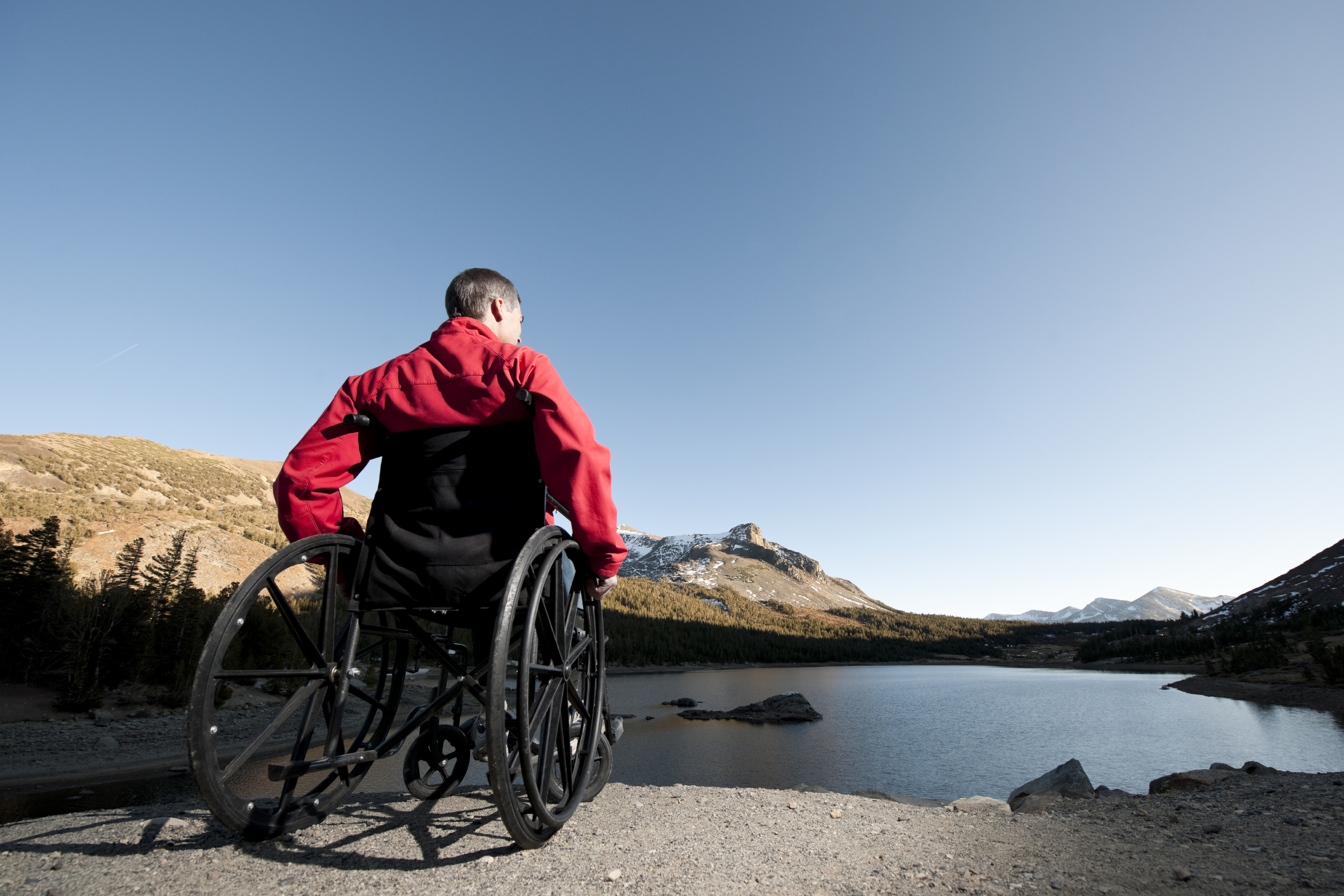 man outdoors in wheelchair