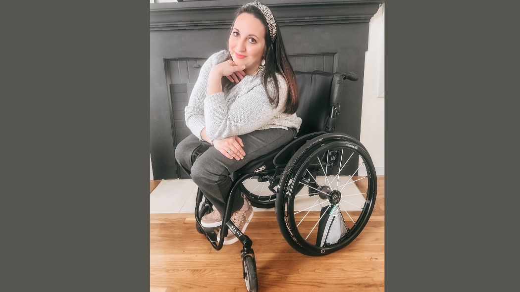 women in a wheelchair next to fireplace