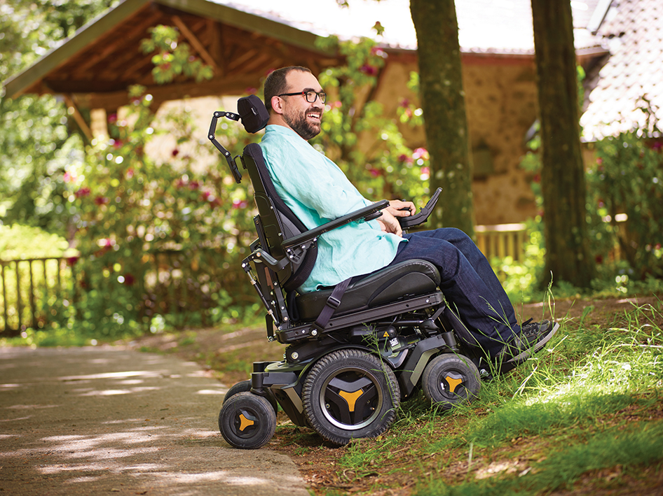 man in powerchair outside