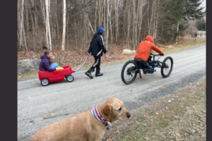 Geoff on adaptive bike with family