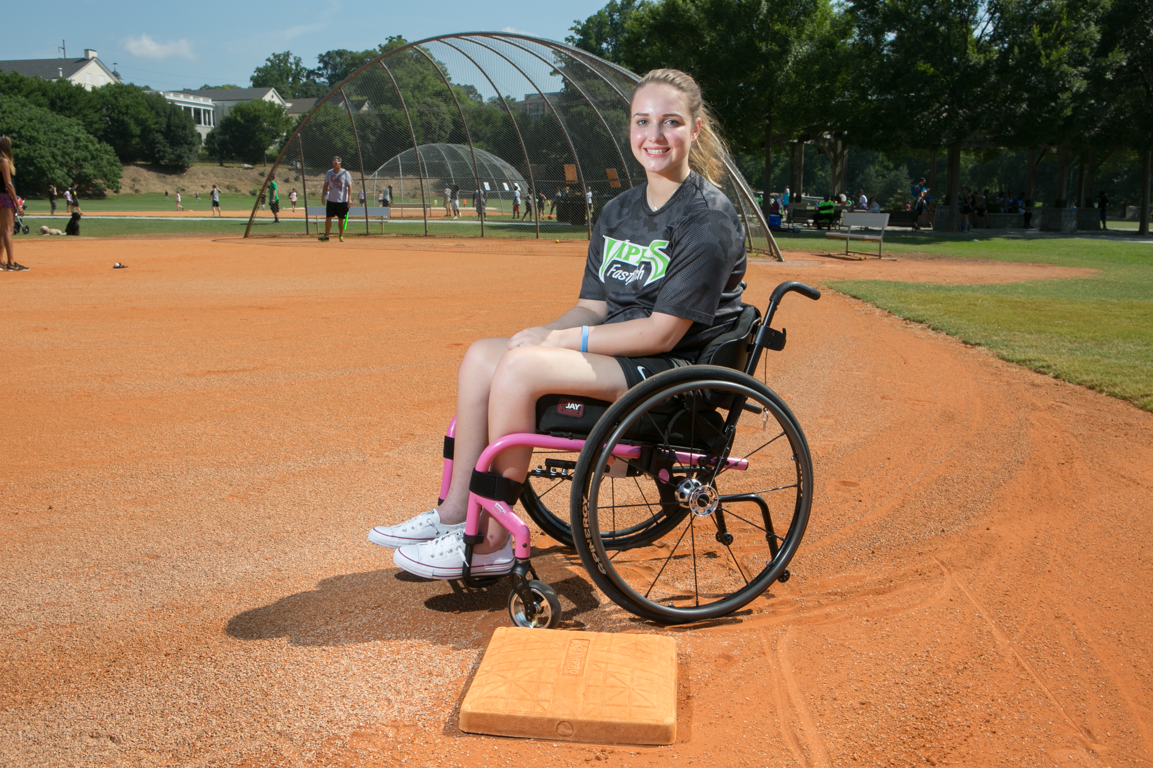 Vicki in wheelchair on baseball field